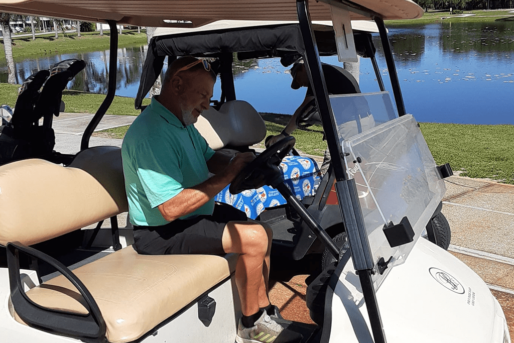 Golfer on golf cart